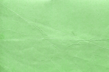 Cardboard green abstract pattern texture close-up. Retro old paper background. Grunge concrete...