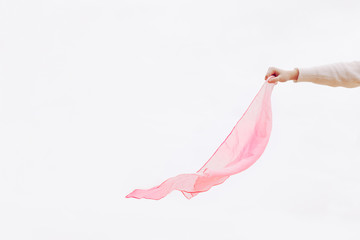 Stock photo of a woman holding a pink handkerchief after cancer - obrazy, fototapety, plakaty