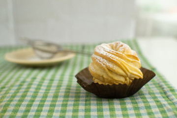 Cruffins without filling on a green background. Rustic style.
