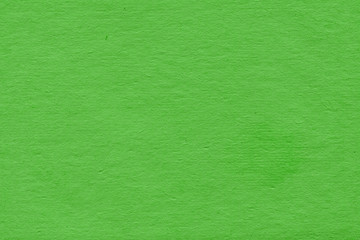 Obraz premium Cardboard green abstract pattern texture close-up. Retro old paper background. Grunge concrete wall. Vintage blank wallpaper.
