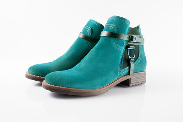 Female blue leather boot on white background, isolated product.