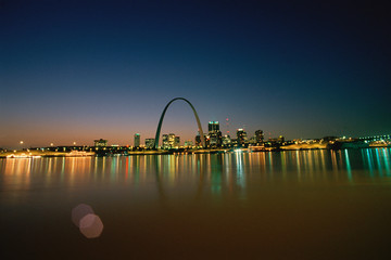 St. Louis at night, reflecting on water