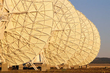 Row of VLA Very Large Array radio telescope dishes