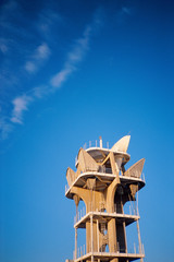 Fototapeta na wymiar Top of antenna against blue sky