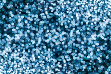 Party festive happy glitter texture. Blue bokeh shiny background. Abstract vibrant color glowing white spots texture for graphic design. Magic colorful backdrop.