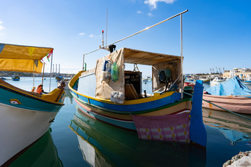 Naklejka na ściany i meble colorful traditinal maltese boat in the harbour of valletta