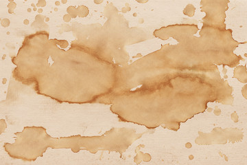 Fototapeta premium Vintage and old looking coffee cup stain background. Painted with a tea retro texture. Grunge paper for drawing. Ancient book page.