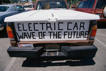 Tailgate of pickup truck with banner, Electric Car, Wave of the Future