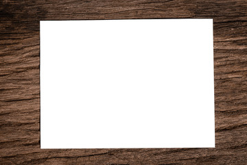 White paper on wood floor background