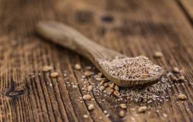 Portion of healthy Wheat Bran (selective focus; close-up shot)