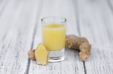 Some fresh Ginger Drink (selective focus; close-up shot)