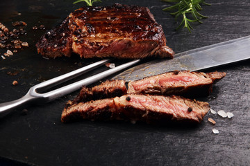 Barbecue Rib Eye Steak on Slate Slab - Dry Aged Wagyu Entrecote Steak and rosemary