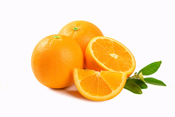 Fresh oranges with half and leaves isolated on white background