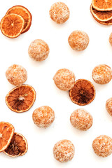 Fototapeta na wymiar Orange sweets. Raw handmade sweets. Healthy low-calorie sweets for vegetarians.