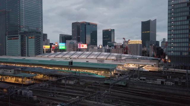 Video of high speed Japanese Shinkansen E7 and N777 trains docked in Tokyo railway station in the Chiyoda City, Tokyo, Japan.
