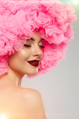 Woman Big Hat and Lips. Model wearing Fabric with lace ruffles hat. High Fashion Model fabric crown or hairstyle