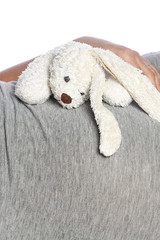 Happy pregnant girl lies on white background