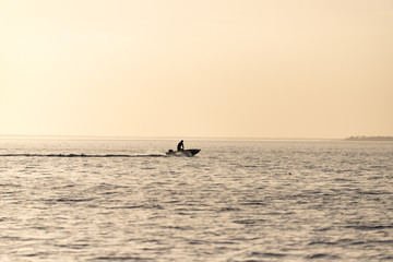 Fototapeta premium Fishing Boat Returning Home at Sunset in Oriental, North Carolina