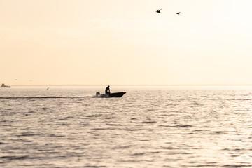 Fototapeta premium Fishing Boat Returning Home at Sunset in Oriental, North Carolina