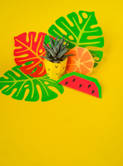 Tropical fruits made of paper. Pineapple flower in a pot.