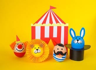 Easter circus. Egg with a funny face.
