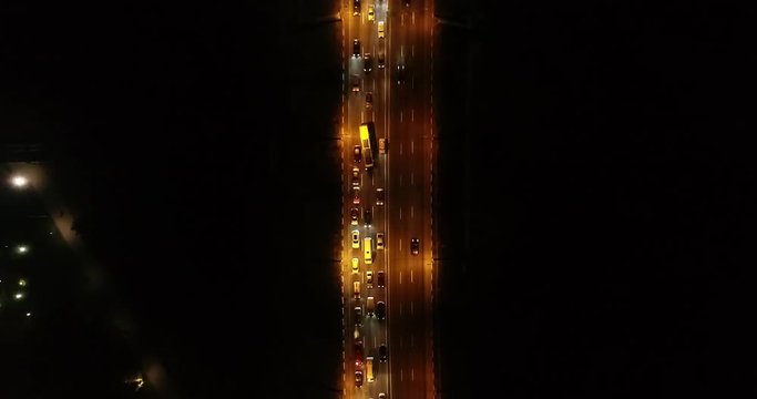 4K Aerial Top Drone View: Accident and traffic jam on the bridge in the evening after a working day. A huge number of cars on the road at rush hour. Downtown, city central part. Dnipro, Ukraine