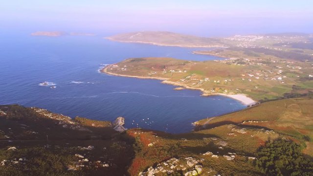 Beautiful Malpica coast. Aerial view of the Barizo sandy beach and the unspoiled nature on a foggy day
