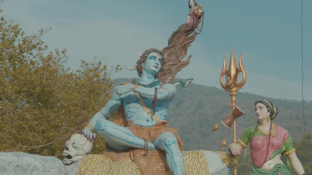 a blue statue of the god Vishnu in Rishikesh, India