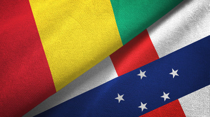 Fototapeta premium Guinea and Netherlands Antilles two flags textile cloth, fabric texture