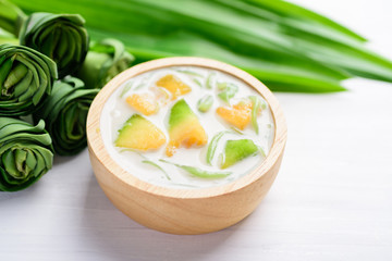 Thai dessert (Lod Chong), rice flour pandan flavor and sliced melon fruit in coconut milk