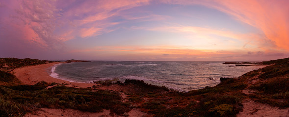 Wide panorama of ocean coast at sunset