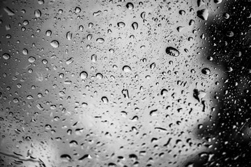 blur backgruond,Rain water on the car glass.