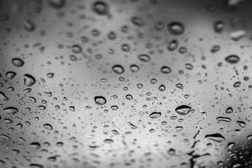 blur backgruond,Rain water on the car glass.