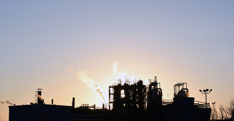 Fototapeta premium A large factory at sunset