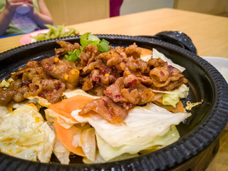 spicy grilled beef rice set close up shot on a wooden table.