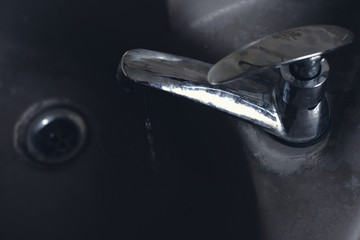 dripping water with chrome tap