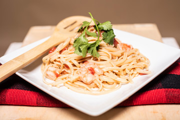 spaghetti with tomato sauce and basil and shrimp