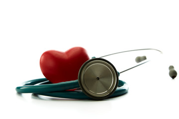 Fototapeta na wymiar Red heart and a stethoscope on white