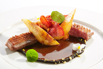 Duck Breast with Stewed Pear, Flowers and Strawberries Isolated