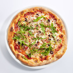 Pizza with Tuna, Olives and Arugula Top View Isolated