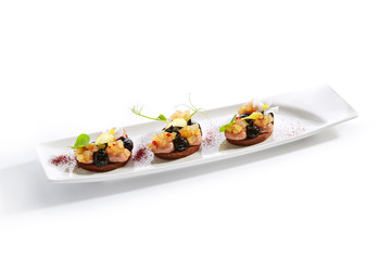 Duck Pate on Toasted Bread with Truffle Oil and Prune Cream Isolated