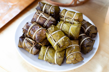 Thai dessert sticky rice with banana (Kao Tom Mad)on plate