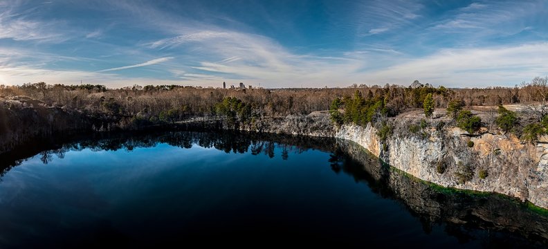 Beautiful scenery of a lake surrounded by rock formations in Winston Salem, North Carolina