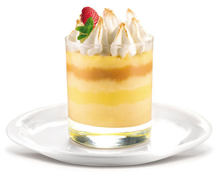 Traditional Suspiro Limeno dessert in a glass with toasted meringue topping isolated on white background