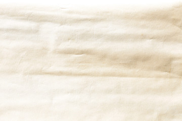 Fototapeta na wymiar Old pale yellow crumpled paper background texture