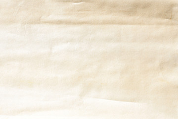 Old pale yellow crumpled paper background texture