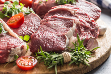 Beef ribe eye steaks with rosemary oregano and tomatoes