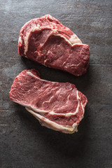 Beef Rib Eye steak on slate board - Top of view