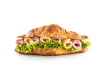 Croissant stuffed with lettuce salad ham and cheese isolated on white background