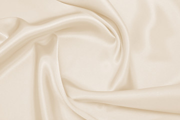 Draped satin beige fabric for festive backgrounds